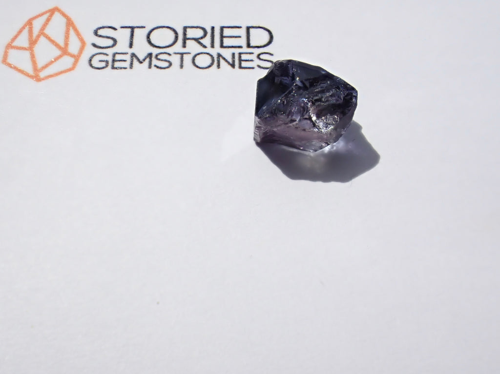 Unheated Pleochroic Tanzanite Gemstone  Rough. Perfect rough for faceting on a Ultra-tec or Facetron This is white paper test shows strong color and clarity