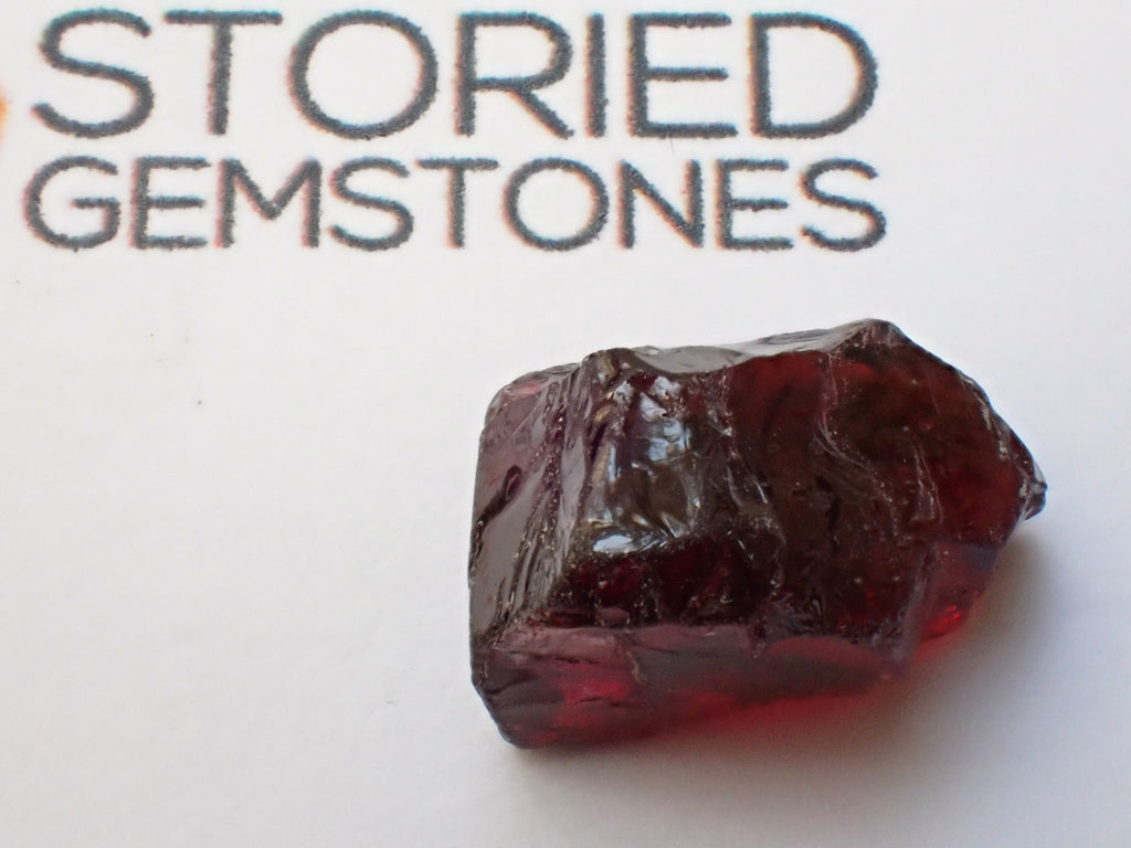 African Red Garnet Great for Faceting, white paper test