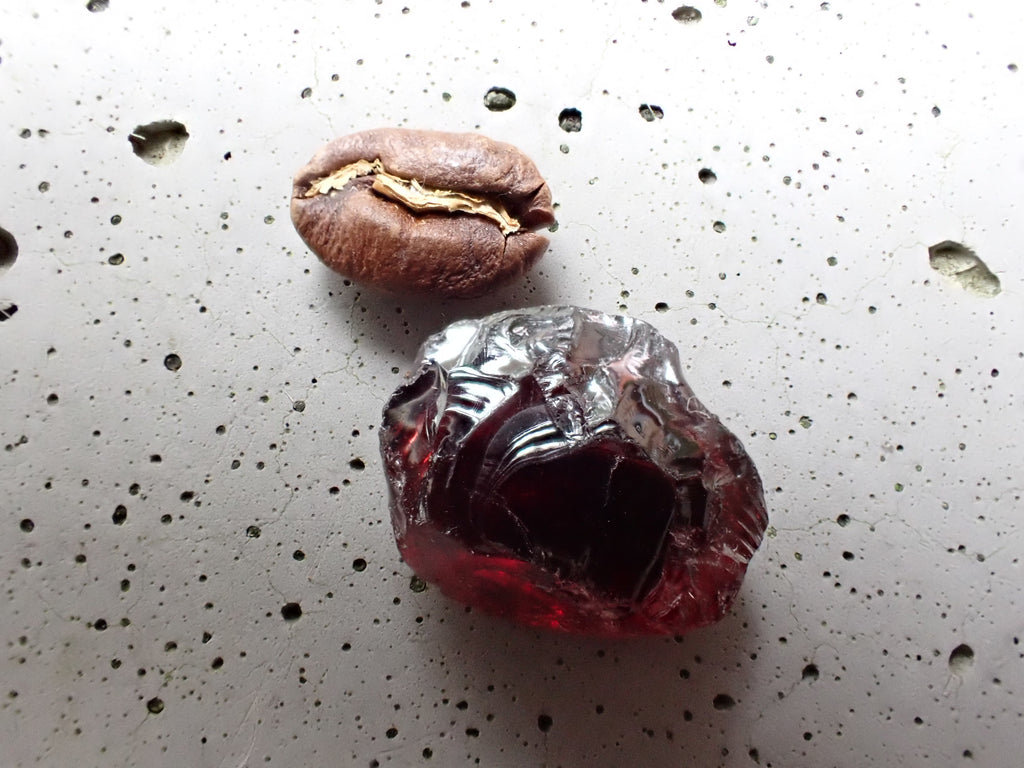 African Red Garnet. Faceting rough.  Red, very little if any brown, peachy overtones. 